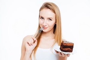 young women eating cake