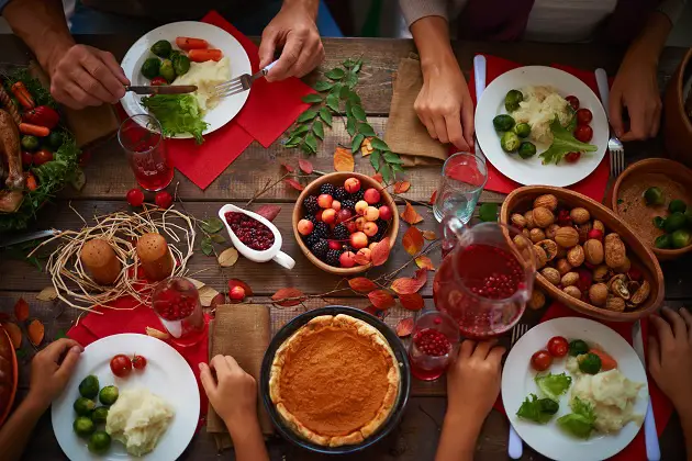 festive table and people eating