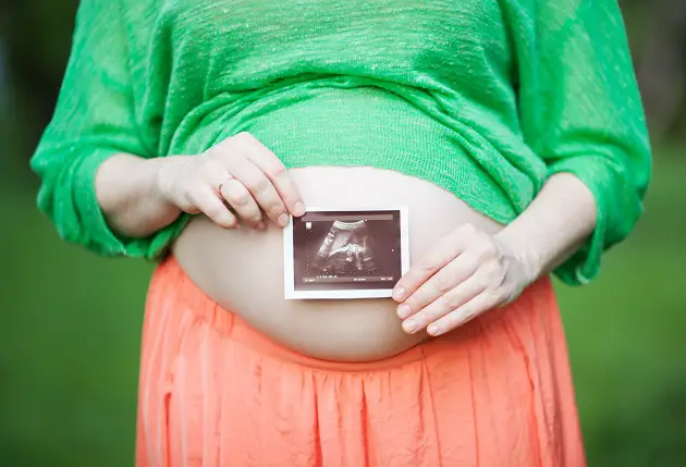 Pregnant woman with ultrasound